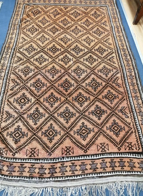 A Turkish geometric rug 240 x 145cm